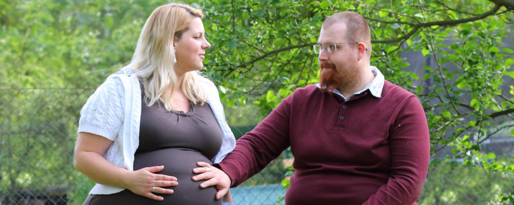 Pregnant couple in park