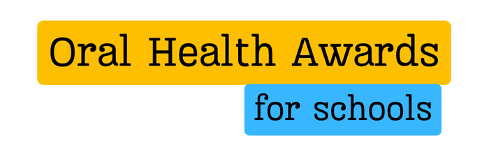 Large yellow box atop a smaller blue box, yellow box reads Oral Health Awards, blue box reads for schools.