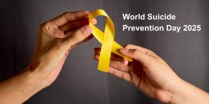 Hands holding a suicide prevention ribbon