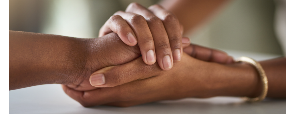 Two people holding hands
