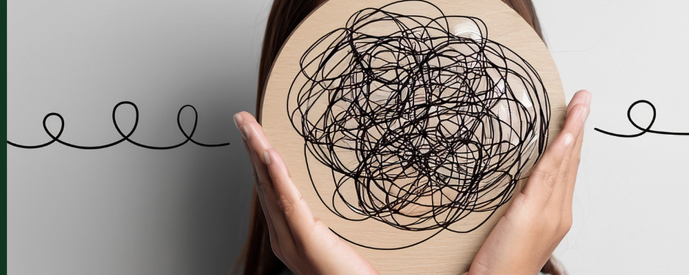 hands holding a circle with black lines