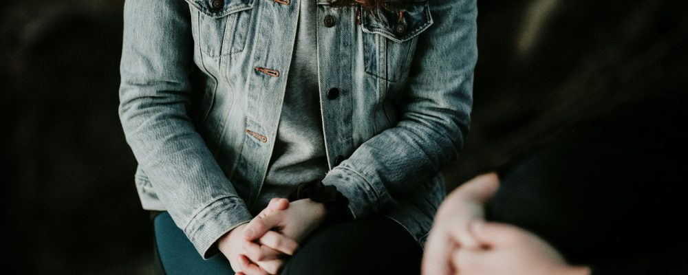 person wearing denim jacker