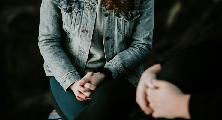 person wearing denim jacker