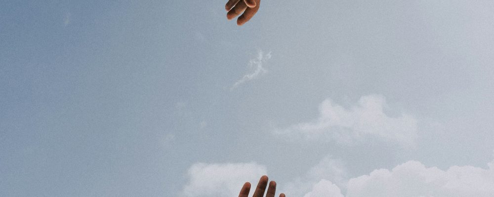 two hands reaching out