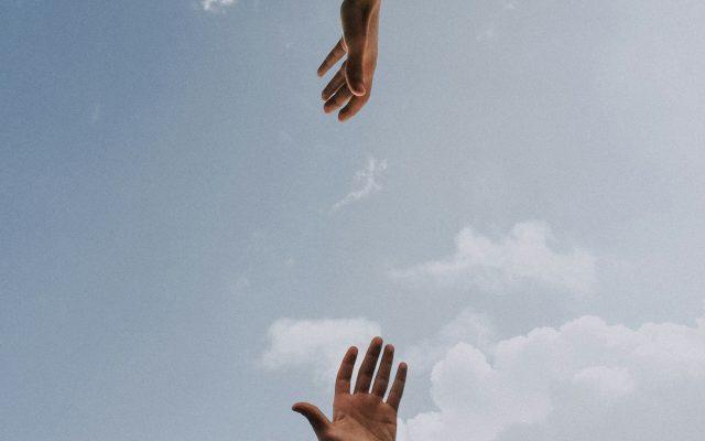two hands reaching out