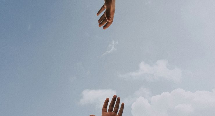 two hands reaching out